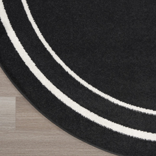 HomeRoots 8' Black And Ivory Round Area Rug - Stylish, Durable, Versatile for Indoor/Outdoor Spaces & High Traffic 545492