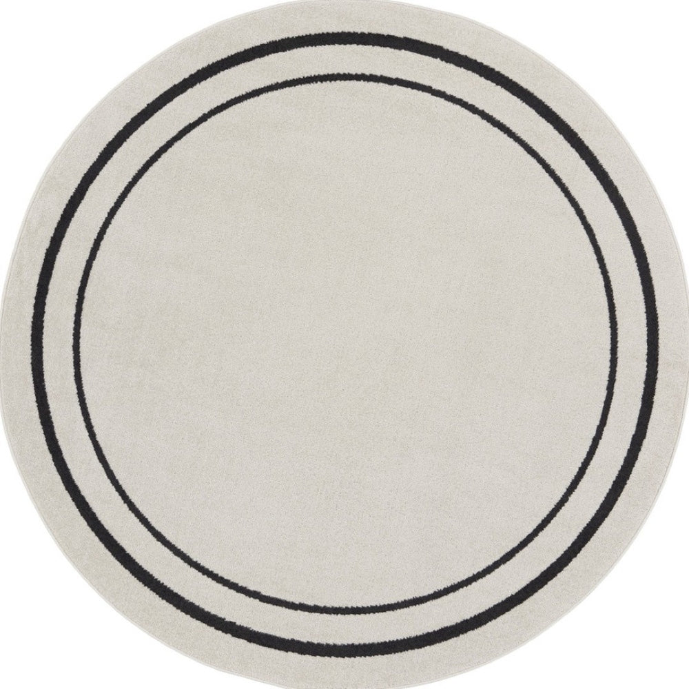 HomeRoots 8' Ivory and Black Round Rug - Weather-Resistant, Stylish Indoor & Outdoor Area Rug for Any Space 545534