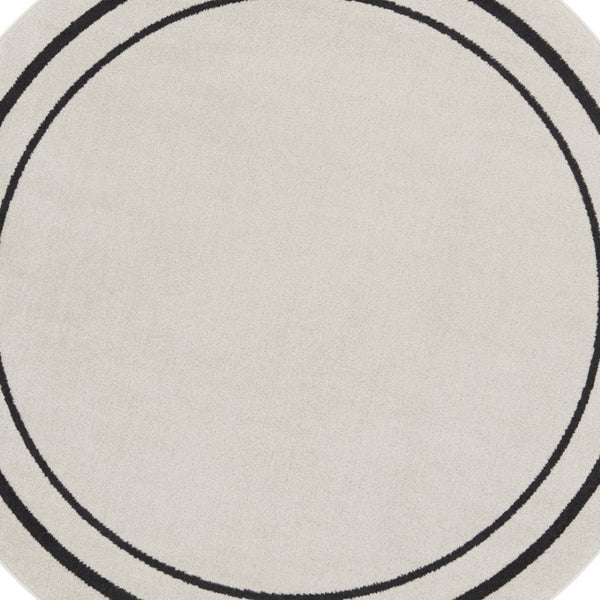 HomeRoots 8' Ivory and Black Round Rug - Weather-Resistant, Stylish Indoor & Outdoor Area Rug for Any Space 545534