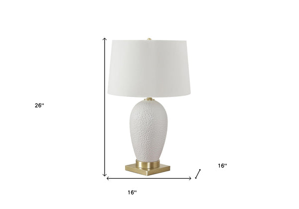 Homeroots 26" Gold And White Ceramic Urn Table Lamp With Cream Empire Shade   545799