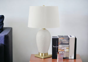 Homeroots 26" Gold And White Ceramic Urn Table Lamp With Cream Empire Shade   545799