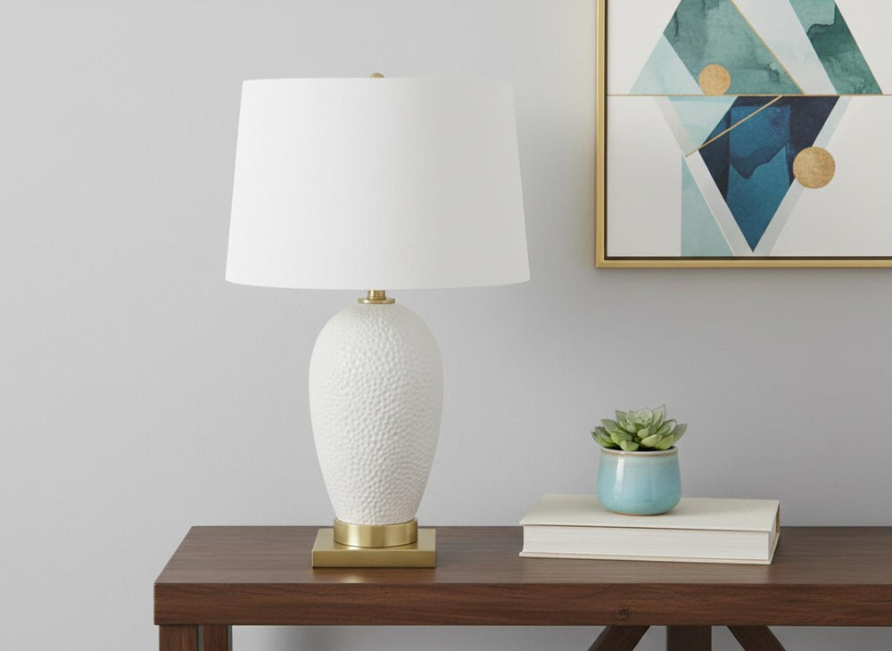 HomeRoots 26" Elegant Gold and White Ceramic Urn Table Lamp with Cream Shade for Stylish Ambient Lighting 545799