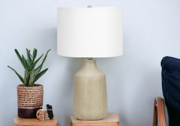 Homeroots 24" Beige Concrete Urn Table Lamp With Ivory Drum Shade   545840