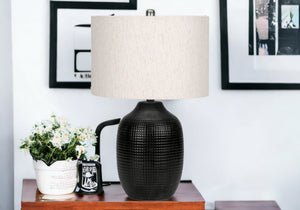 Homeroots 26" Black Ceramic Urn Table Lamp With Ivory Drum Shade   545843