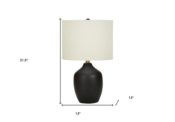 Homeroots 22" Black Ceramic Urn Table Lamp With Ivory Drum Shade   545846