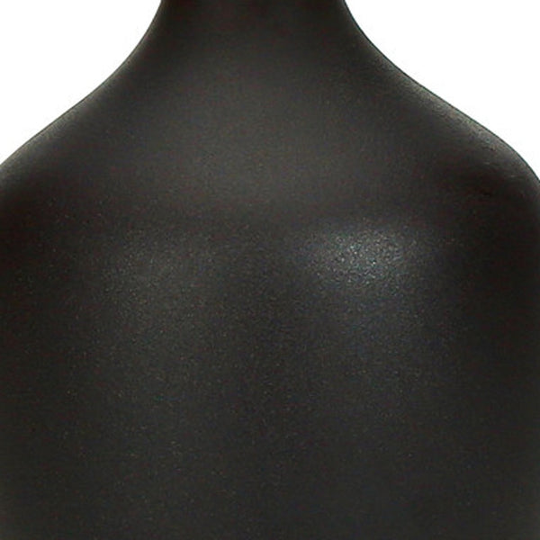 Homeroots 22" Black Ceramic Urn Table Lamp With Ivory Drum Shade   545846