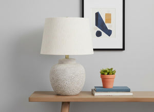 HomeRoots 22" Cream Concrete Urn Table Lamp - Modern Design with Soft Linen Shade for Ambient Illumination 545870
