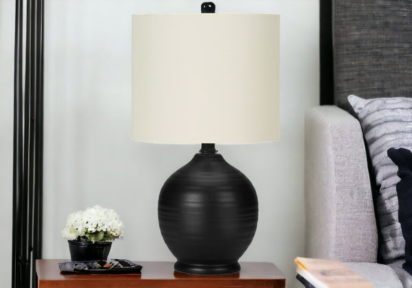 Homeroots 17" Black Ceramic Round Table Lamp With Ivory Drum Shade   545874