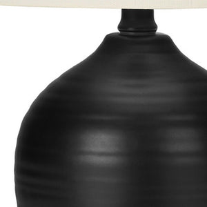 Homeroots 17" Black Ceramic Round Table Lamp With Ivory Drum Shade   545874