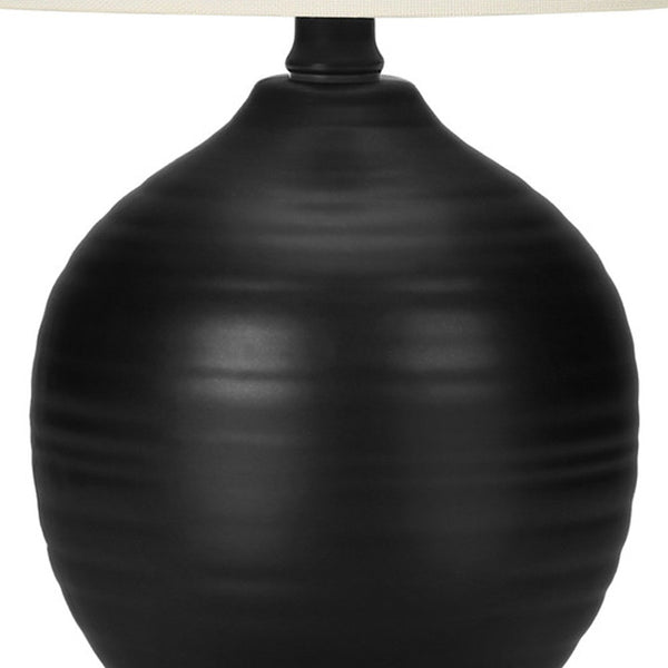 Homeroots 17" Black Ceramic Round Table Lamp With Ivory Drum Shade   545874