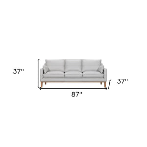 HomeRoots 87" Gray Leather Sofa with Stylish Toss Pillows & Sturdy Brown Legs for Modern Living Room Décor 546408