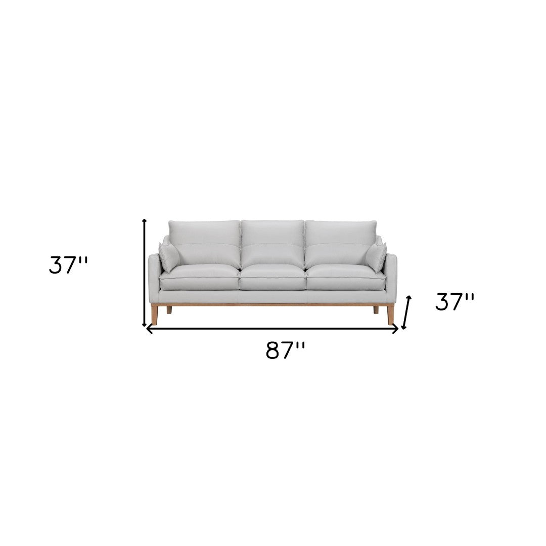 HomeRoots 87" Gray Leather Sofa with Stylish Toss Pillows & Sturdy Brown Legs for Modern Living Room Décor 546408