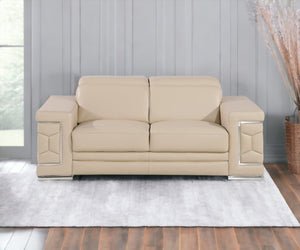HomeRoots 70" Contemporary Leather Loveseat with Silver Accents, Adjustable Headrests, and Sleek Steel Legs CREAM 546439