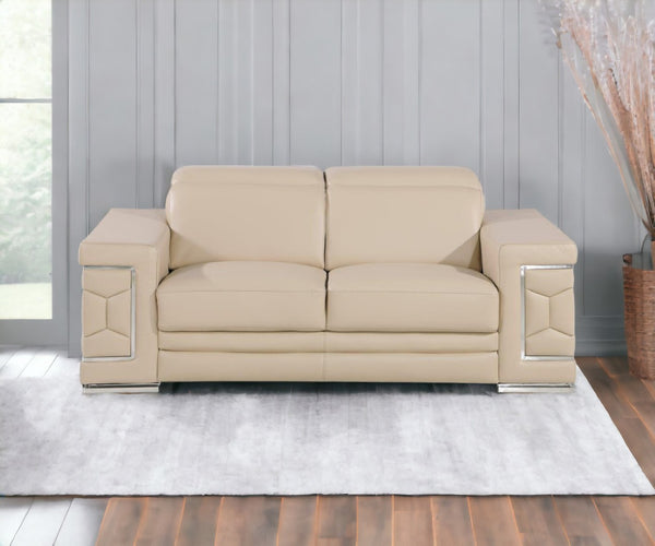 HomeRoots 70" Contemporary Leather Loveseat with Silver Accents, Adjustable Headrests, and Sleek Steel Legs CREAM 546439