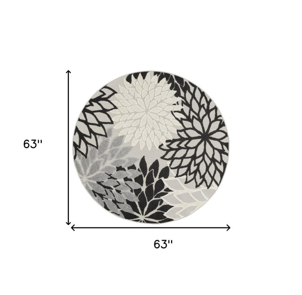 HomeRoots 5' Black and White Round Floral Area Rug - Durable Indoor/Outdoor Accent for High-Traffic Spaces 546648