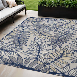 HomeRoots 5' Coastal-Inspired Navy Blue and Ivory Botanical Indoor Outdoor Area Rug for Versatile Spaces 5' X 8' 546668