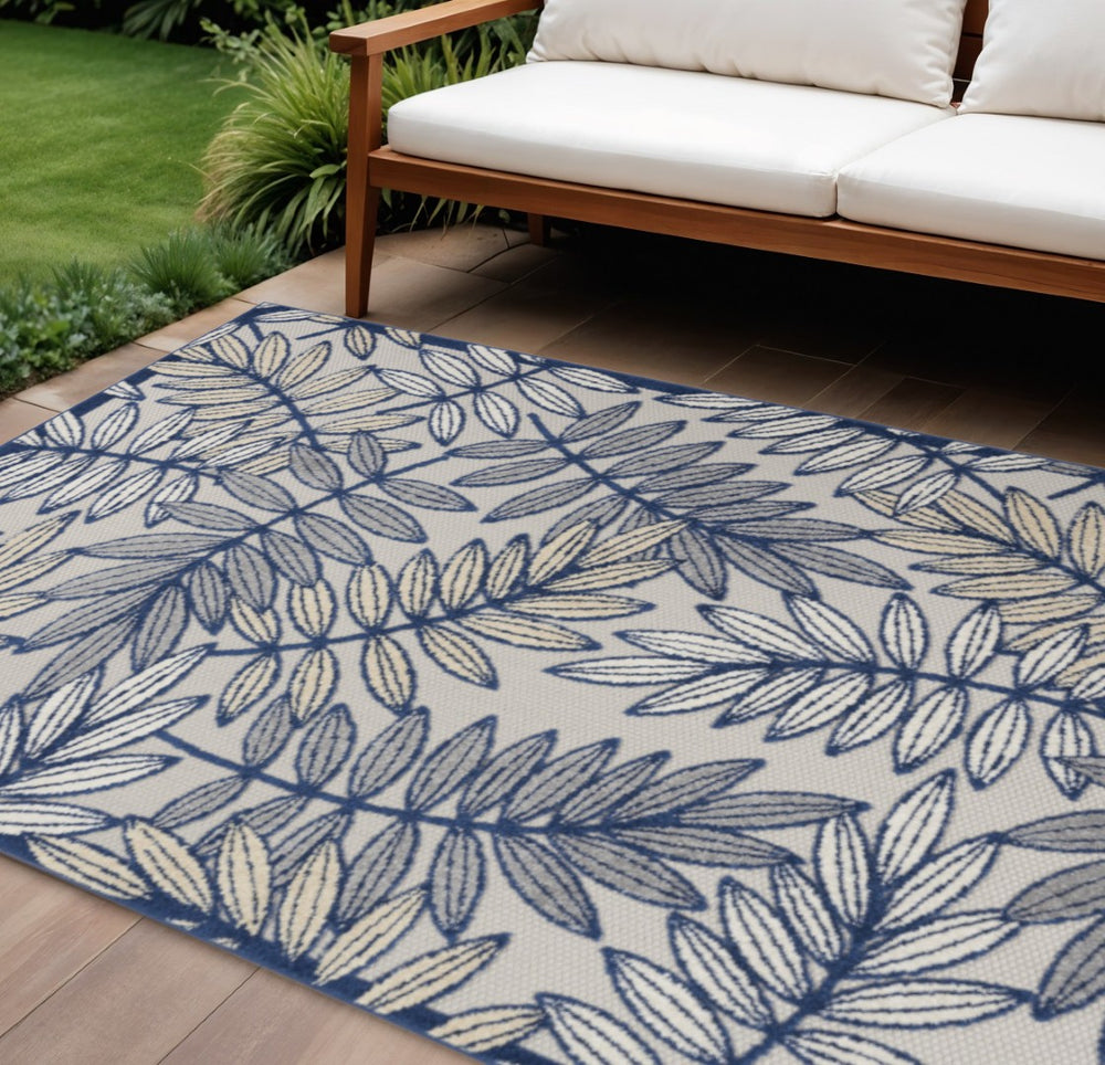 HomeRoots 5' Coastal-Inspired Navy Blue and Ivory Botanical Indoor Outdoor Area Rug for Versatile Spaces 6' X 9' 546680