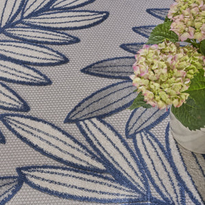 HomeRoots 5' Coastal-Inspired Navy Blue and Ivory Botanical Indoor Outdoor Area Rug for Versatile Spaces 7' X 10' 546689