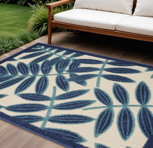 HomeRoots 8' Navy Blue and Ivory Palm Leaf Area Rug - Versatile Indoor/Outdoor Design for Modern Spaces 546694