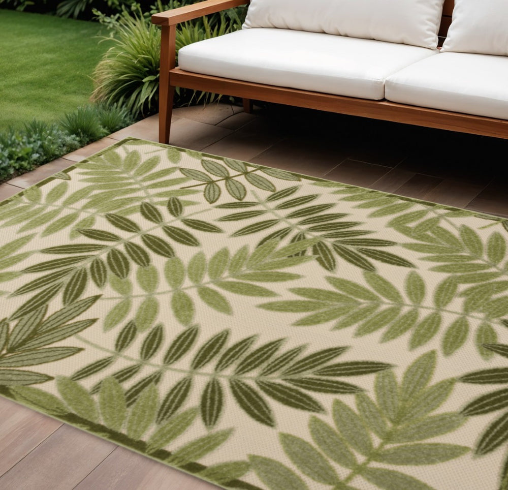 HomeRoots 10' X 14' Ivory Palm Leaf Area Rug - Durable Indoor/Outdoor Tropical Decor for High-Traffic Spaces 548102