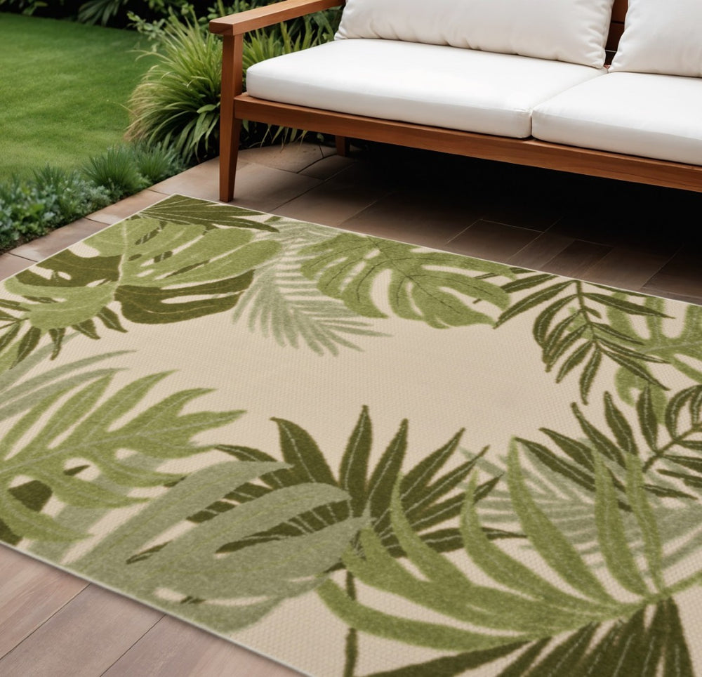 HomeRoots 9' Tropical Ivory and Green Palm Leaf Area Rug - Durable Indoor/Outdoor Design for Coastal Spaces 548119