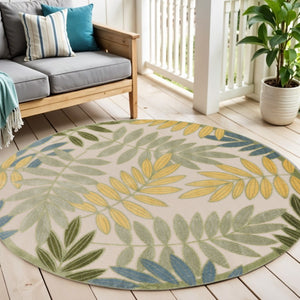 HomeRoots 5' Tropical Palm Leaf Area Rug - Durable Indoor/Outdoor Round Rug in Green, Yellow, Ivory Colors 548137