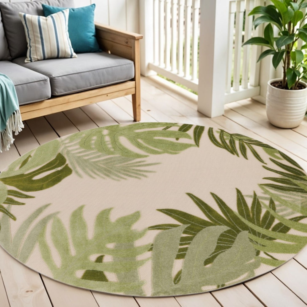 HomeRoots 5' Ivory and Green Round Palm Leaf Area Rug - Stylish, Durable Indoor/Outdoor Décor for Any Space 548145