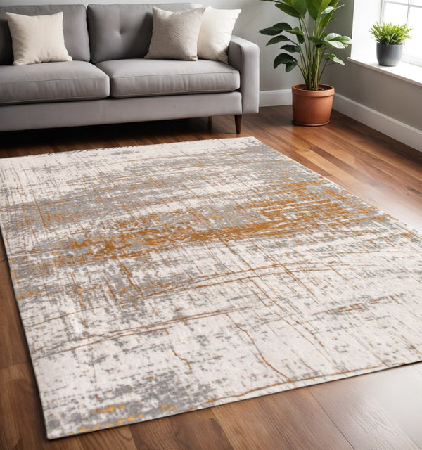 HomeRoots 3'' Gray and Gold Abstract Non-Skid Area Rug for High-Traffic Spaces - Elegant & Durable Design 5' X 7' 548389