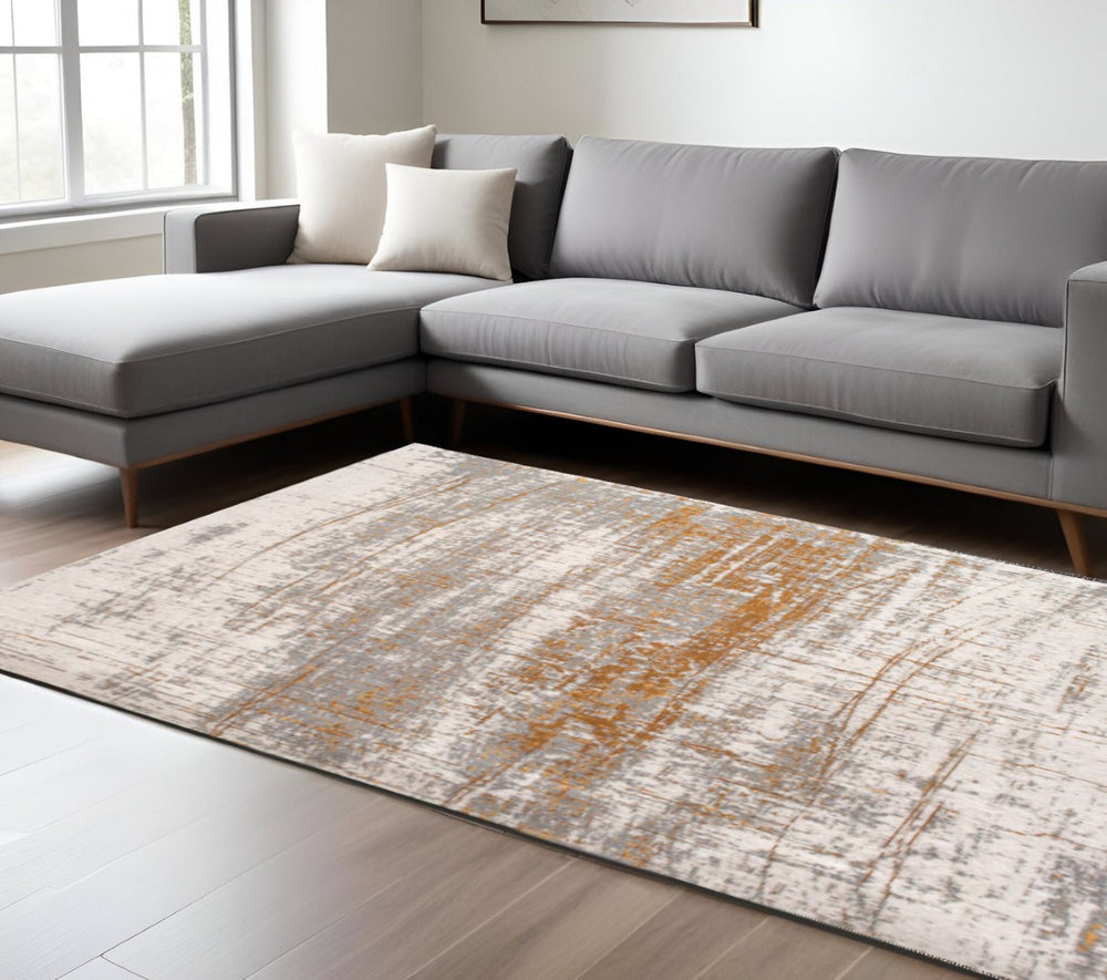 HomeRoots 3'' Gray and Gold Abstract Non-Skid Area Rug for High-Traffic Spaces - Elegant & Durable Design 8' X 11' 548392
