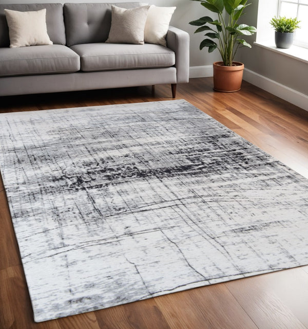 HomeRoots 3' Modern Black and White Abstract Non-Skid Area Rug for Stylish Home Decor and Everyday Use 5' X 7' 548549