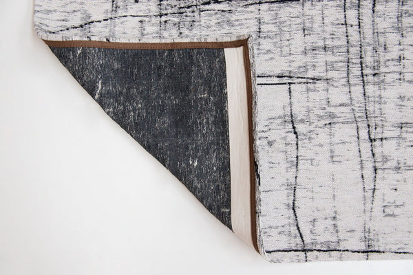HomeRoots 9' X 13' Modern Black and White Abstract Area Rug with Non-Skid Backing for High-Traffic Spaces 548553