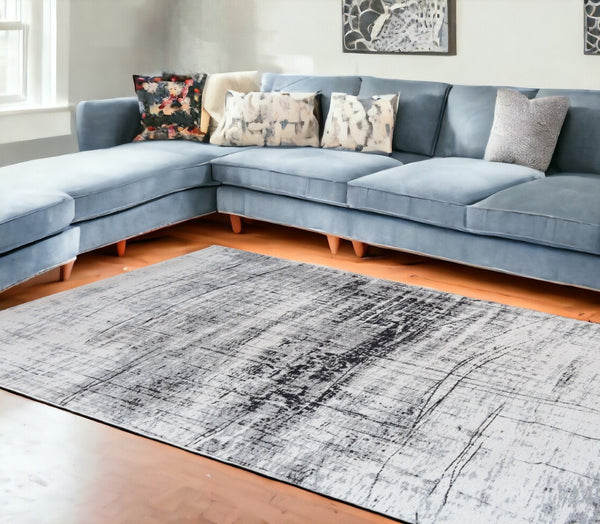 HomeRoots 9' X 13' Modern Black and White Abstract Area Rug with Non-Skid Backing for High-Traffic Spaces 548553