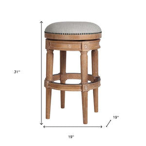 Homeroots 31" Beige And Natural Solid Wood Swivel Backless Bar Height Bar Chair   550093