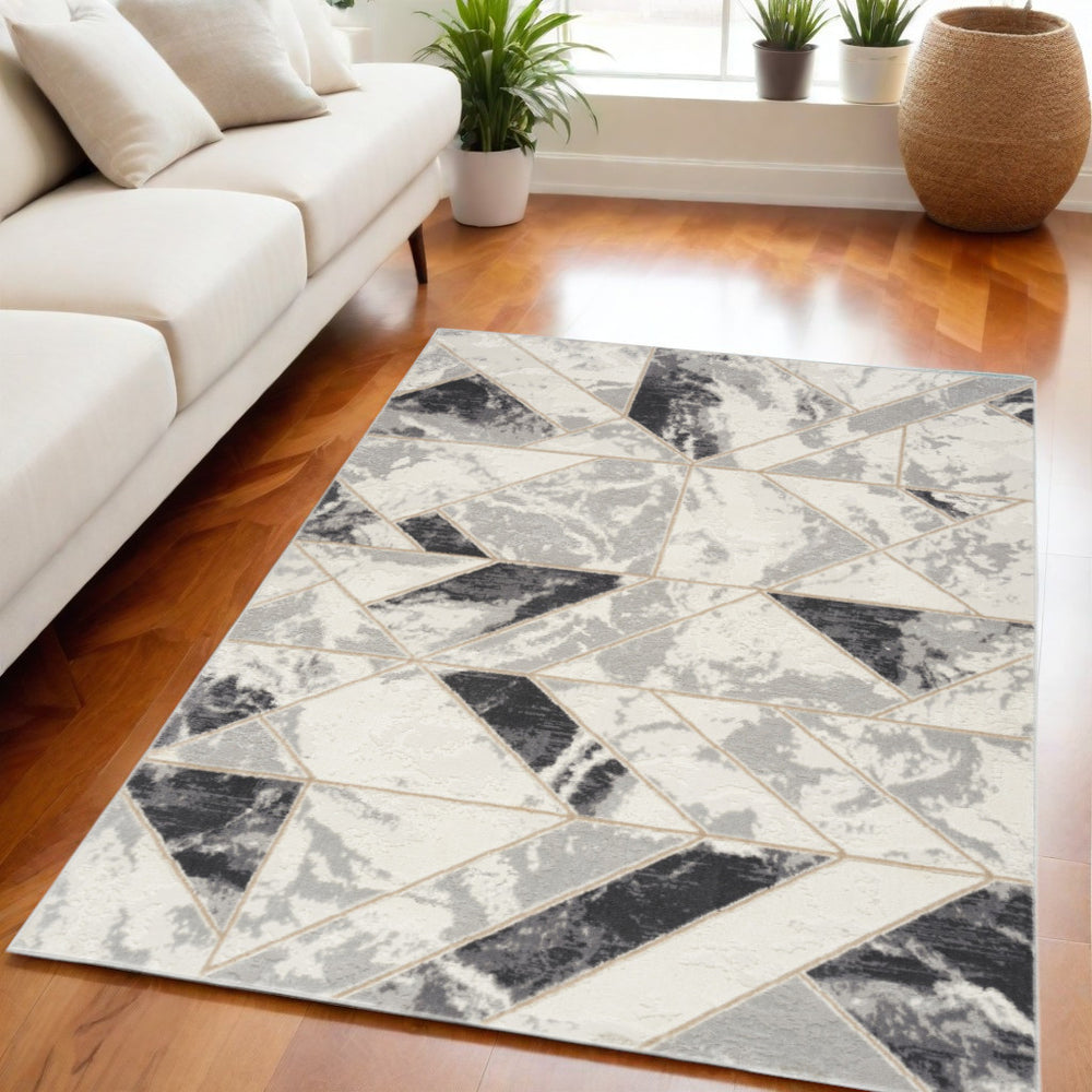 Homeroots 5' X 7' Ivory Black And Gray Abstract Non Skid Area Rug  Polypropylene,Polyester 550170