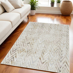 Homeroots 5' X 7' Beige Blue And Ivory Chevron Distressed Non Skid Area Rug  Polyester 550215