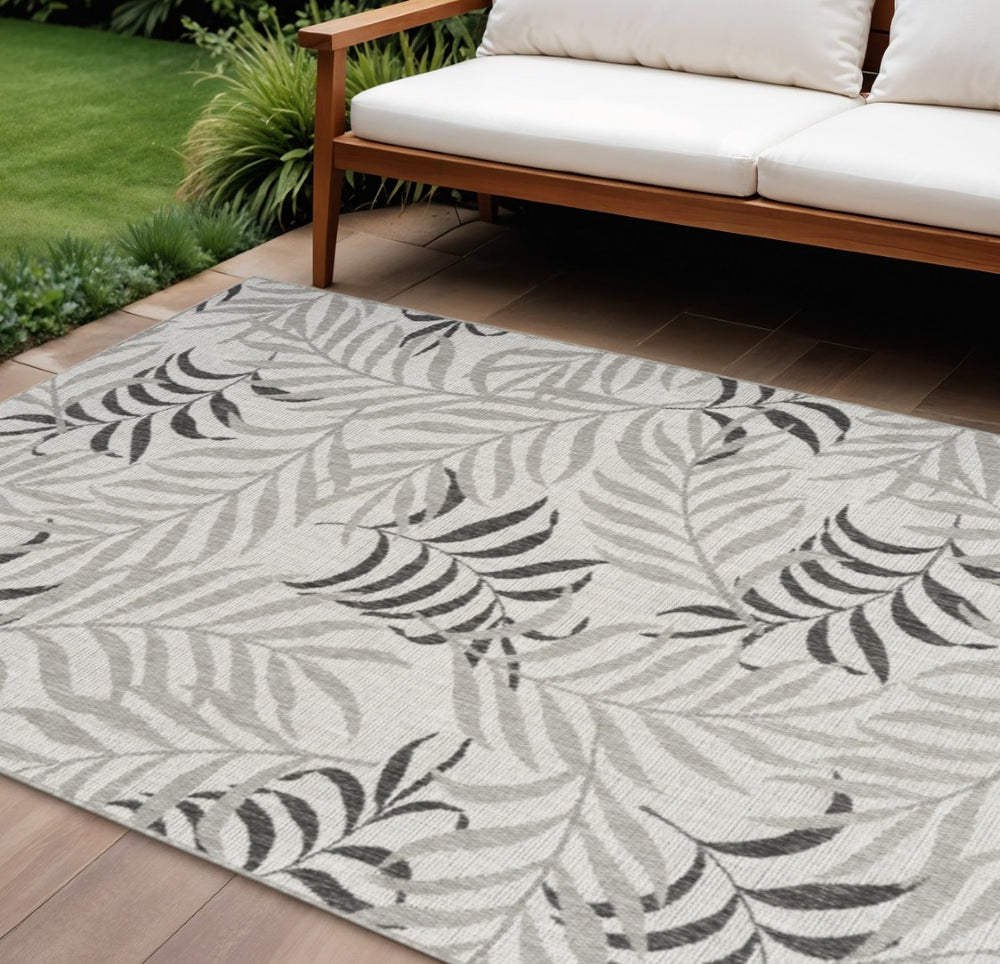 HomeRoots 8' X 10' Gray Black Ivory Palm Leaf Rug - Stylish Indoor/Outdoor Area Rug for Tropical Elegance! 550235