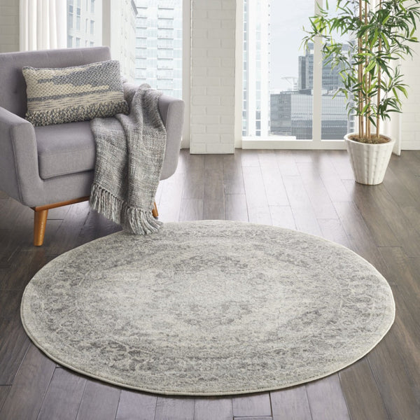 HomeRoots 8' Floral Medallion Distressed Rug in Ivory and Gray – Timeless Elegance for Any Home Decor 8' Round 550271