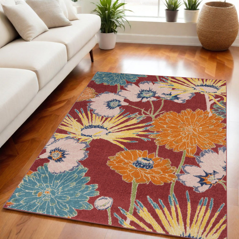 Homeroots 5' X 7' Orange And Red Floral Power Loom Area Rug  Polypropylene 550298