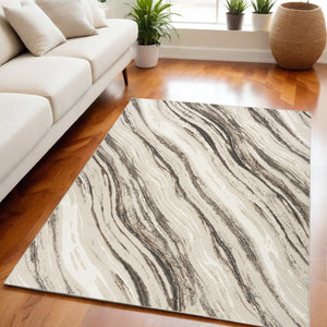 Homeroots 5' X 7' Beige Black And Gray Abstract Non Skid Area Rug  Polyester 550303