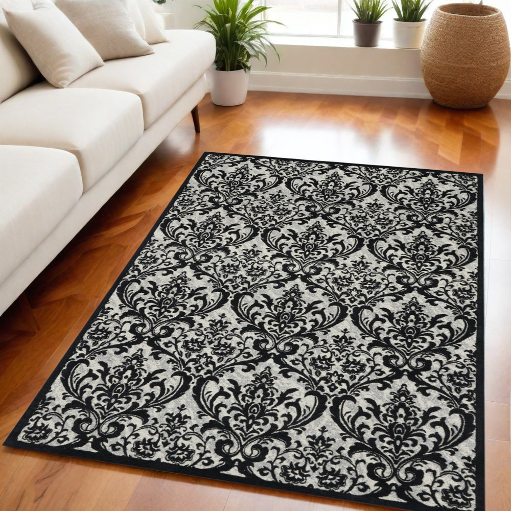 Homeroots 5' X 7' Ivory And Black Damask Distressed Area Rug  Cotton,Polyester 550377