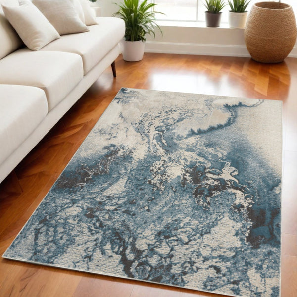 HomeRoots 5' Modern Teal and Ivory Abstract Area Rug - Stylish, Non-Skid, Stain-Resistant for High-Traffic Spaces 5' X 7' 550443
