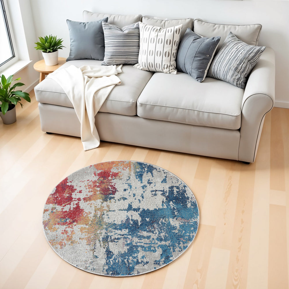 Homeroots 4' Ivory Red And Blue Abstract Distressed Non Skid Round Rug  Polypropylene,Polyester 550473