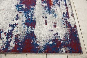 HomeRoots 5' Abstract Ivory Red and Blue Non-Skid Area Rug – Stylish, Durable, Stain-Resistant Design for Any Room 5' X 7' 550556