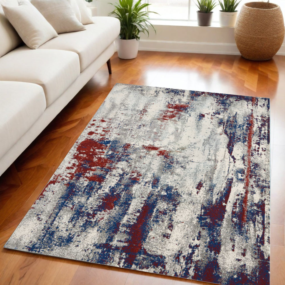 Homeroots 5' X 7' Ivory Red And Blue Abstract Non Skid Area Rug  Polyester 550556