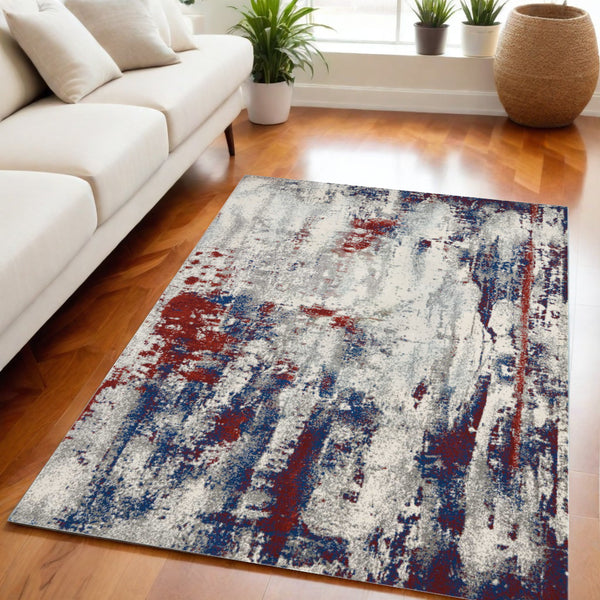 Homeroots 5' X 7' Ivory Red And Blue Abstract Non Skid Area Rug  Polyester 550556