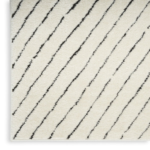 HomeRoots 5' X 7' Ivory and Black Abstract Area Rug - Durable, Stain-Resistant, Modern Design for High-Traffic Homes 550592