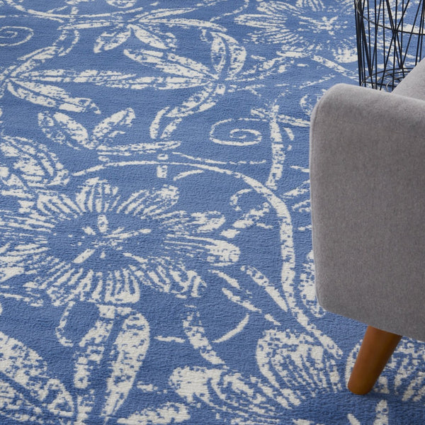 HomeRoots 7' Ivory and Blue Floral Distressed Area Rug - Timeless Charm for High-Traffic Spaces and Homes 7' X 10' 550616