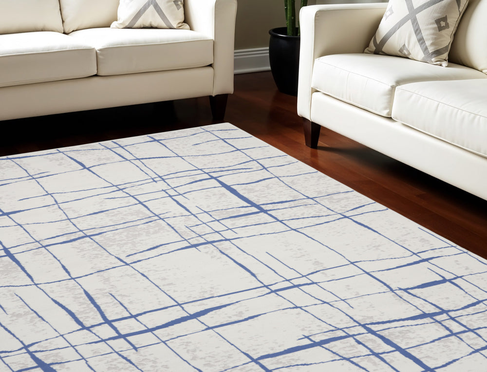 Homeroots 7' X 10' Ivory And Blue Abstract Distressed Non Skid Area Rug  Polypropylene 550635
