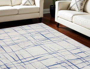 Homeroots 7' X 10' Ivory And Blue Abstract Distressed Non Skid Area Rug  Polypropylene 550635