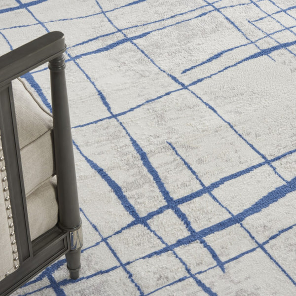 HomeRoots 7' Elegant Ivory and Blue Abstract Distressed Area Rug - Durable, Stain-Resistant, Stylish Design 7' X 10' 550635